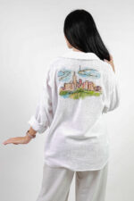 woman wearing linen shirt with embroidery