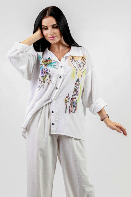 woman wearing linen shirt with embroidery and hand painted deatils