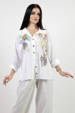 woman wearing linen shirt with embroidery
