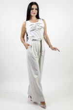 woman wearing linen top and linen trousers
