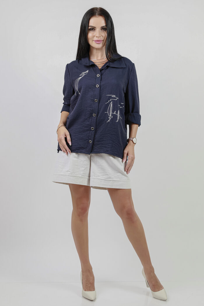 Woman Wearing Blue Cotton Shirt With Embroidery And Linen Shorts