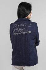 woman wearing blue cotton shirt with embroidery