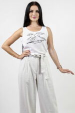 woman wearing linen trousers and linen top