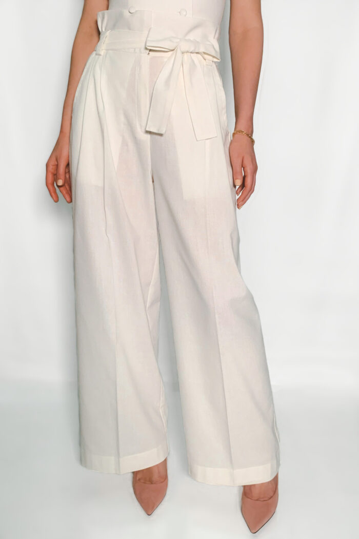 Model Wearing High-Rise Trousers Off White Colour