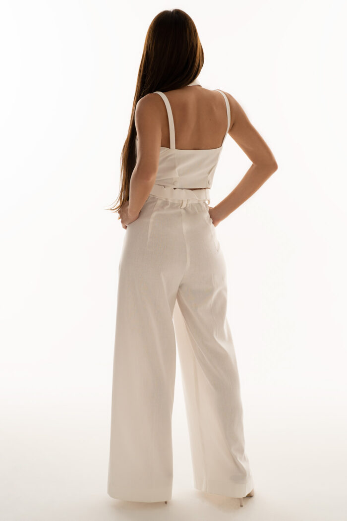 Woman Wearing High-Rise Linen Trousers With Cropped Top