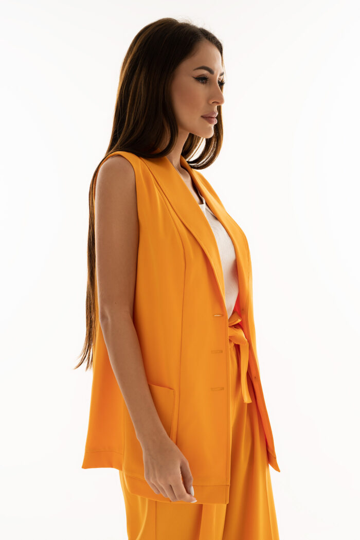 Woman Wearing Orange Waistcoat With Pockets