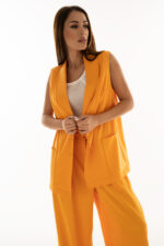 Woman wearing orange waistcoat with pockets