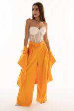 Woman wearing high-rise trousers orange color