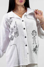 woman wearing linen shirt with embroidery