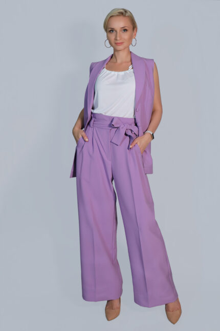 woman wearing waistcoat with pockets and high-rise trousers