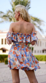 woman wearing short summer dress with ruffles