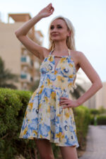 woman wearing floral mini dress