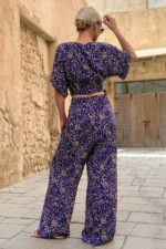 woman wearing cotton trousers and cropped top