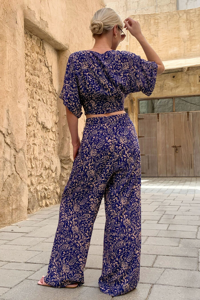 Woman Wearing Cotton Trousers And Cropped Top
