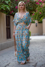 woman wearing cotton cropped top and high-rise trousers