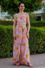 woman wearing cropped top and wrap skirt floral print