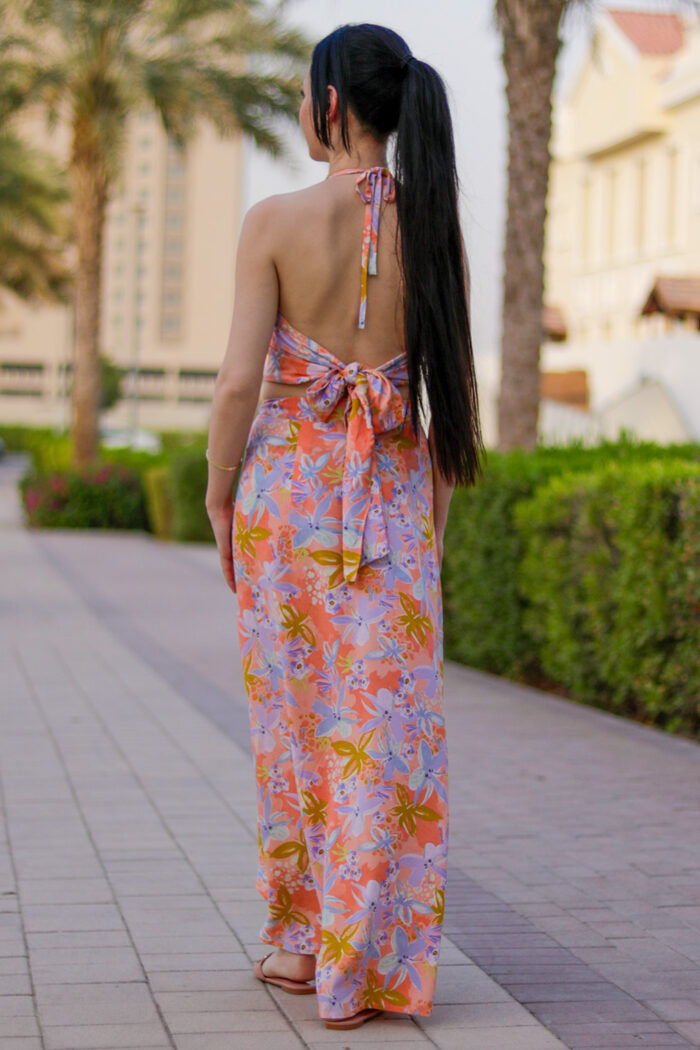 Woman Wearing Long Wrap Skirt And Cropped Top