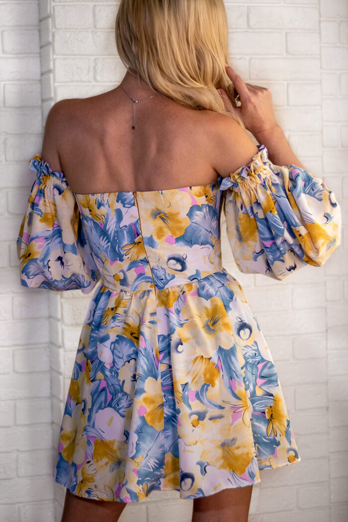 Woman Wearing Summer Mini Dress Floral Print View From The Back