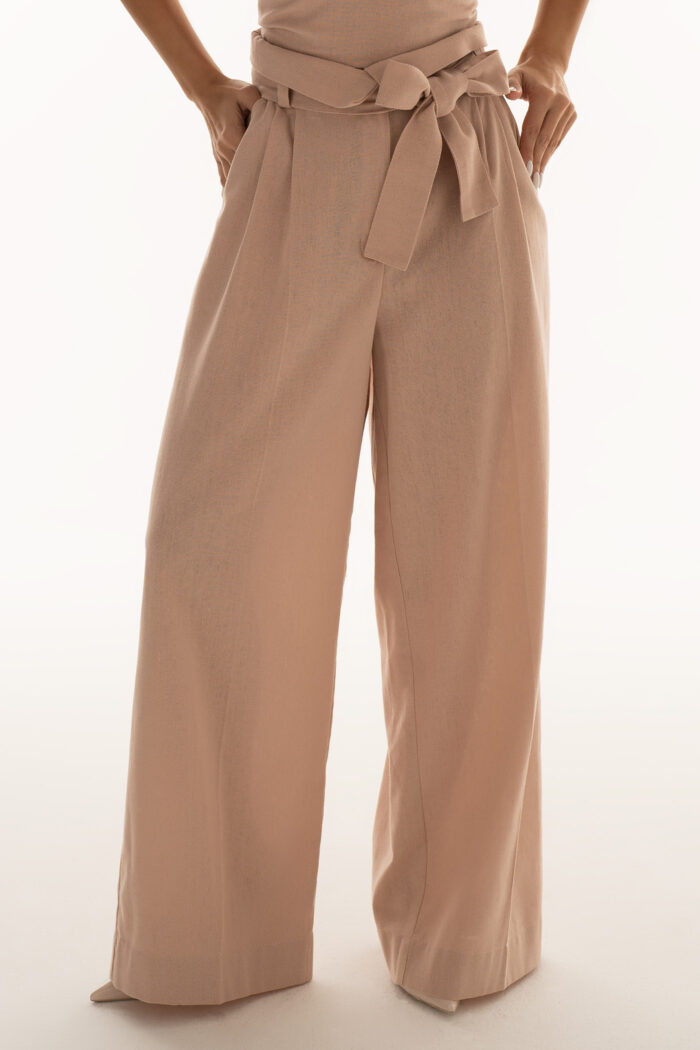 Woman Wearing High-Rise Trousers Made Of Linen