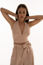 woman wearing pink cropped top