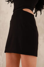 woman wearing black mini skirt with open hips area