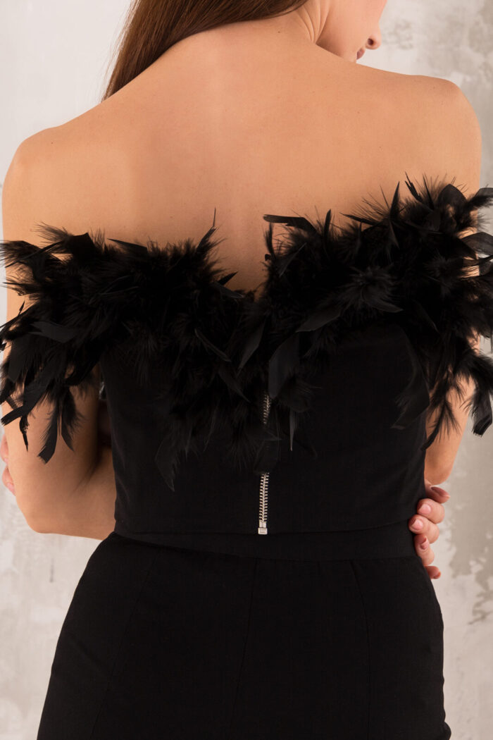 Woman Wearing Black Top Decorated With Feathers