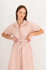 woman wearing long linen dress with sleeves