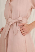 woman wearing long linen dress with sleeves