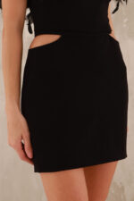 woman wearing black mini skirt with open hips area