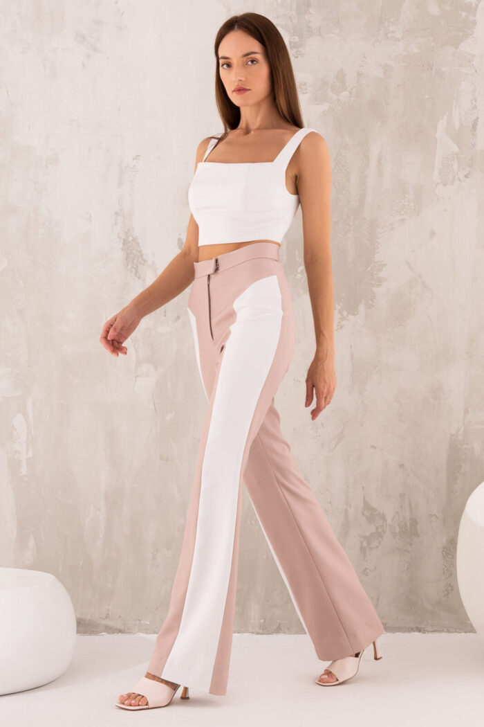 Woman Wearing High-Waisted Trousers Beige And White Color