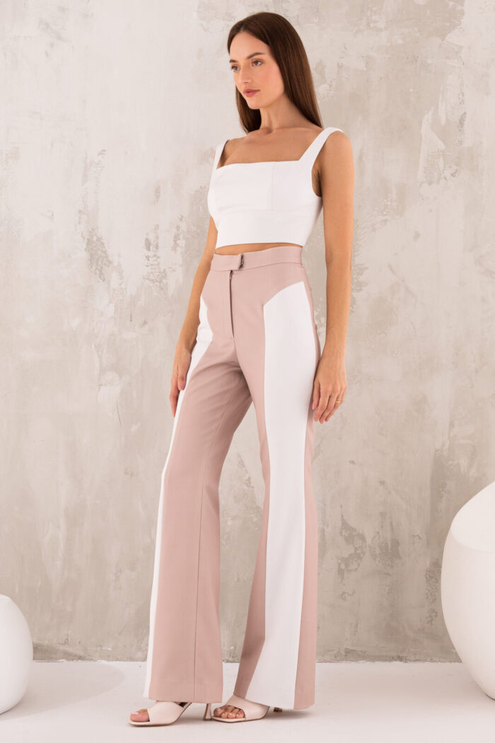Woman Wearing High-Waisted Trousers Beige And White Color
