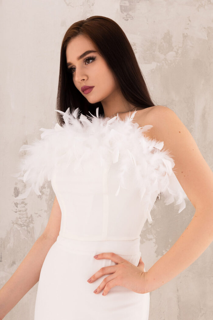 Woman Wearing White Top With Feathers