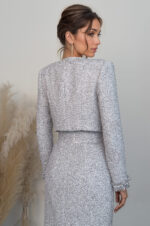 woman wearing boucle cropped jacket and cropped top