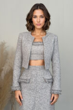 woman wearing boucle cropped jacket and cropped top