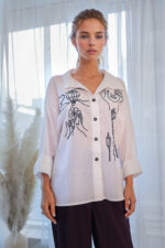 woman wearing cotton shirt with embroidery