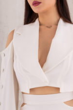 woman wearing off white cropped jacket