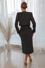 woman wearing tweed cropped jacket