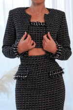 woman wearing tweed cropped jacket