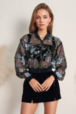 woman wearing bomber jacket made of tulle