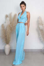 woman wearing wide-leg trousers and crop top