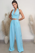 woman wearing wide-leg trousers and crop top