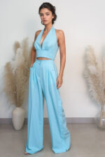 woman wearing wide-leg trousers and crop top